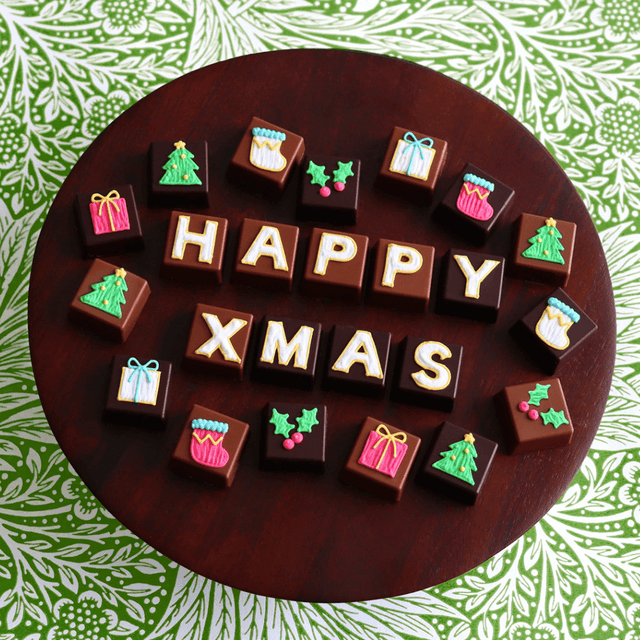 image of Hand-iced assorted chocolate tin